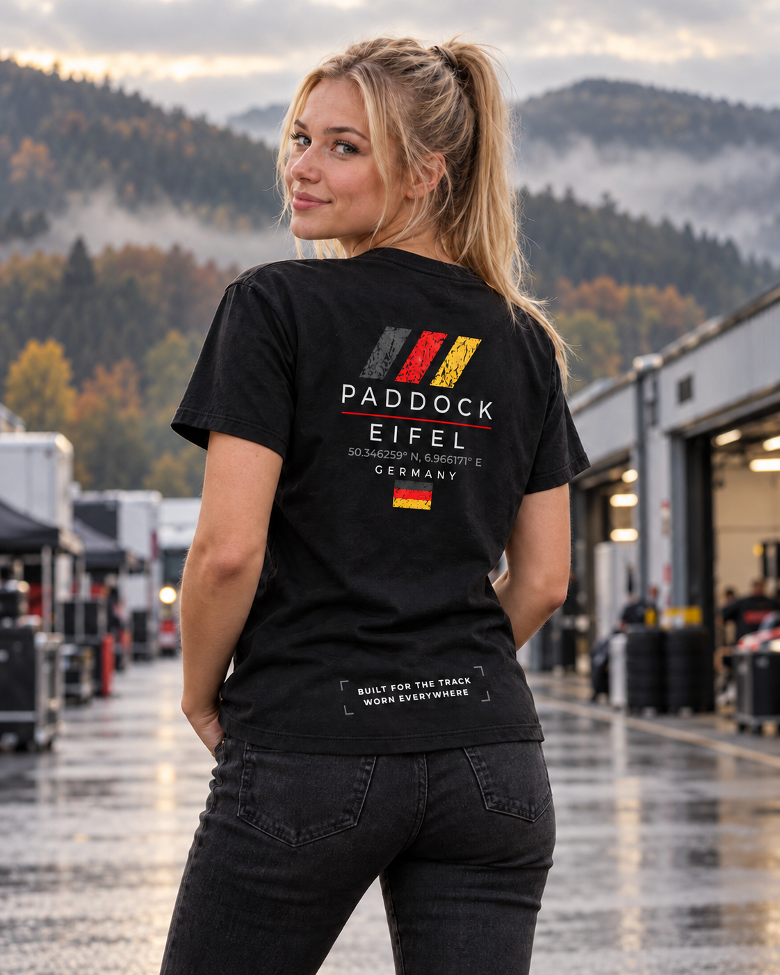 Woman wearing a GRYD1 Paddock Eifel T-shirt in an atmospheric Eifel motorsport setting | Shared