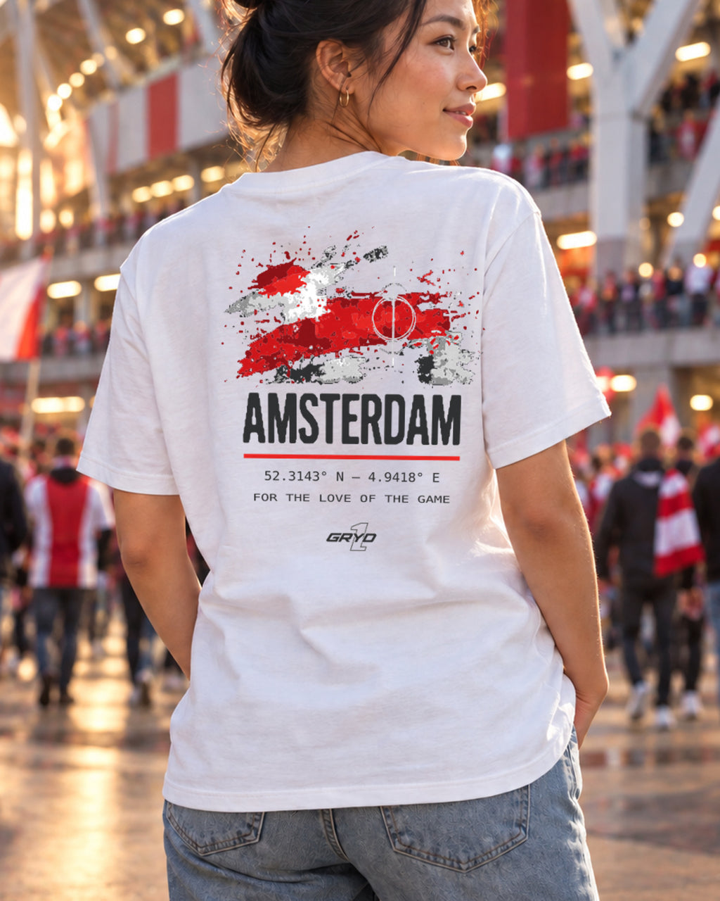 Woman wearing a GRYD1 Stadium Amsterdam T-shirt in a football stadium atmosphere | Shared