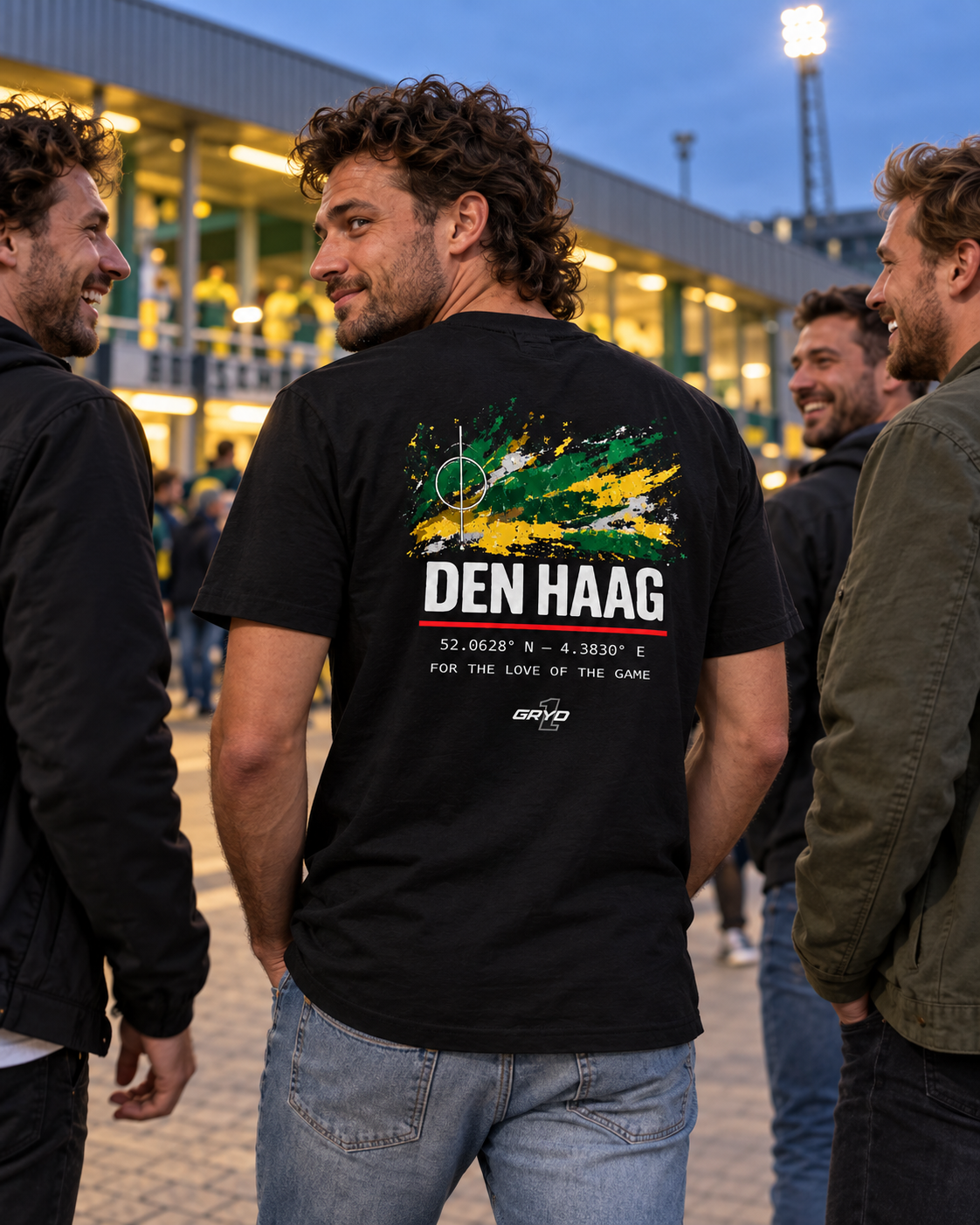 Man wearing a GRYD1 Stadium Den Haag T-shirt with friends outside a football stadium | Shared
