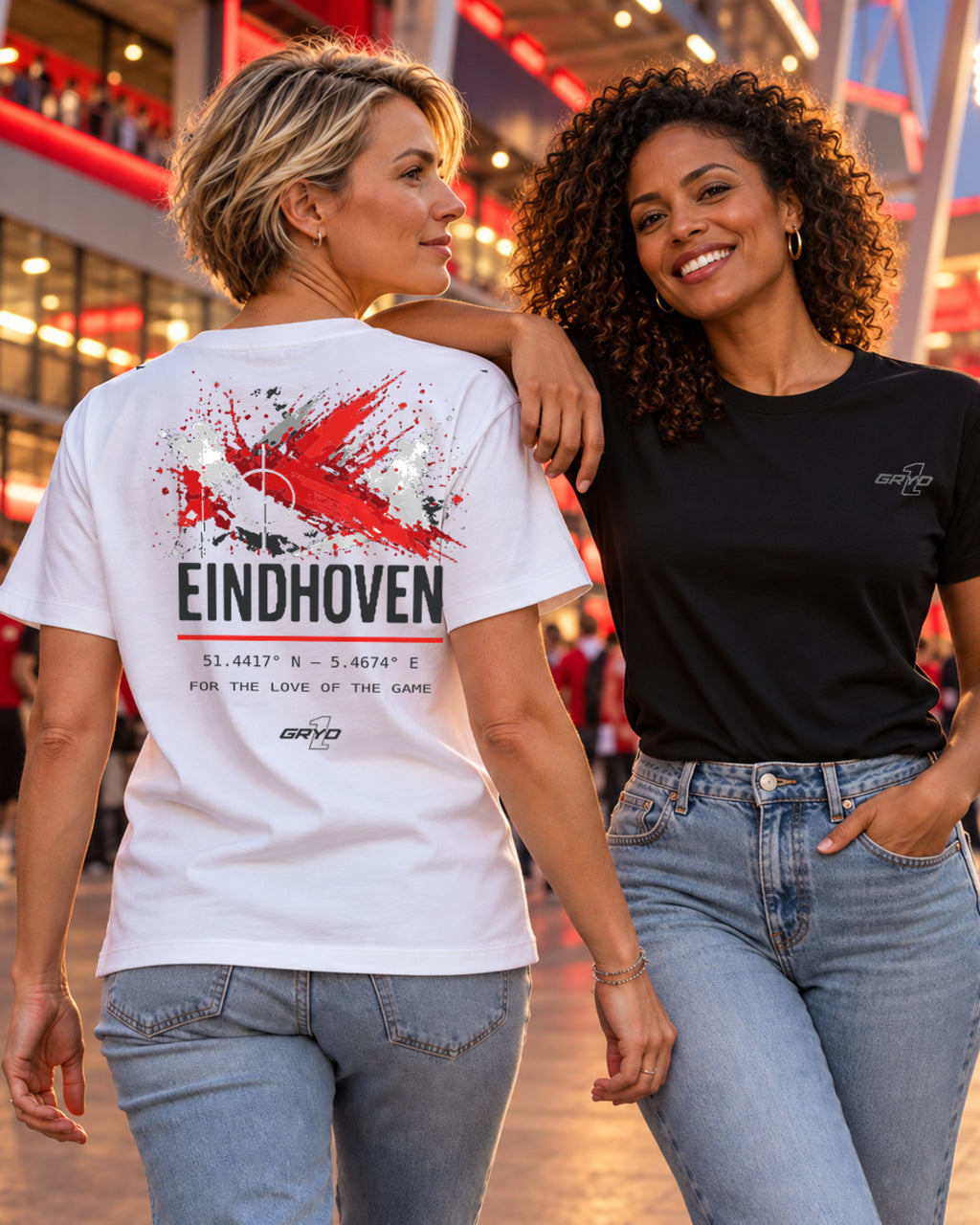 Two women wearing GRYD1 apparel in a football stadium atmosphere in Eindhoven | Shared