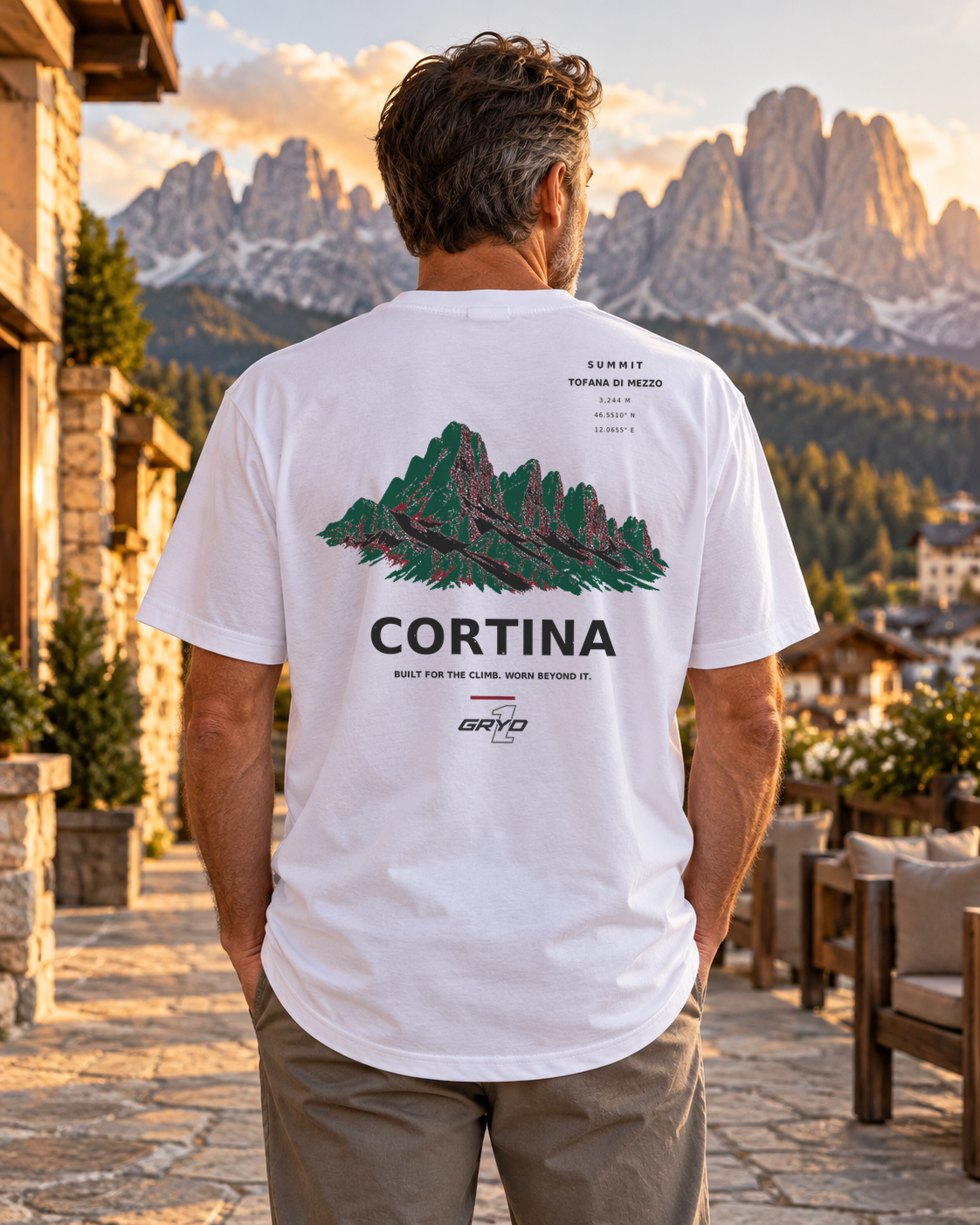 Person wearing a GRYD1 Summit Cortina T-shirt in an alpine setting | Shared