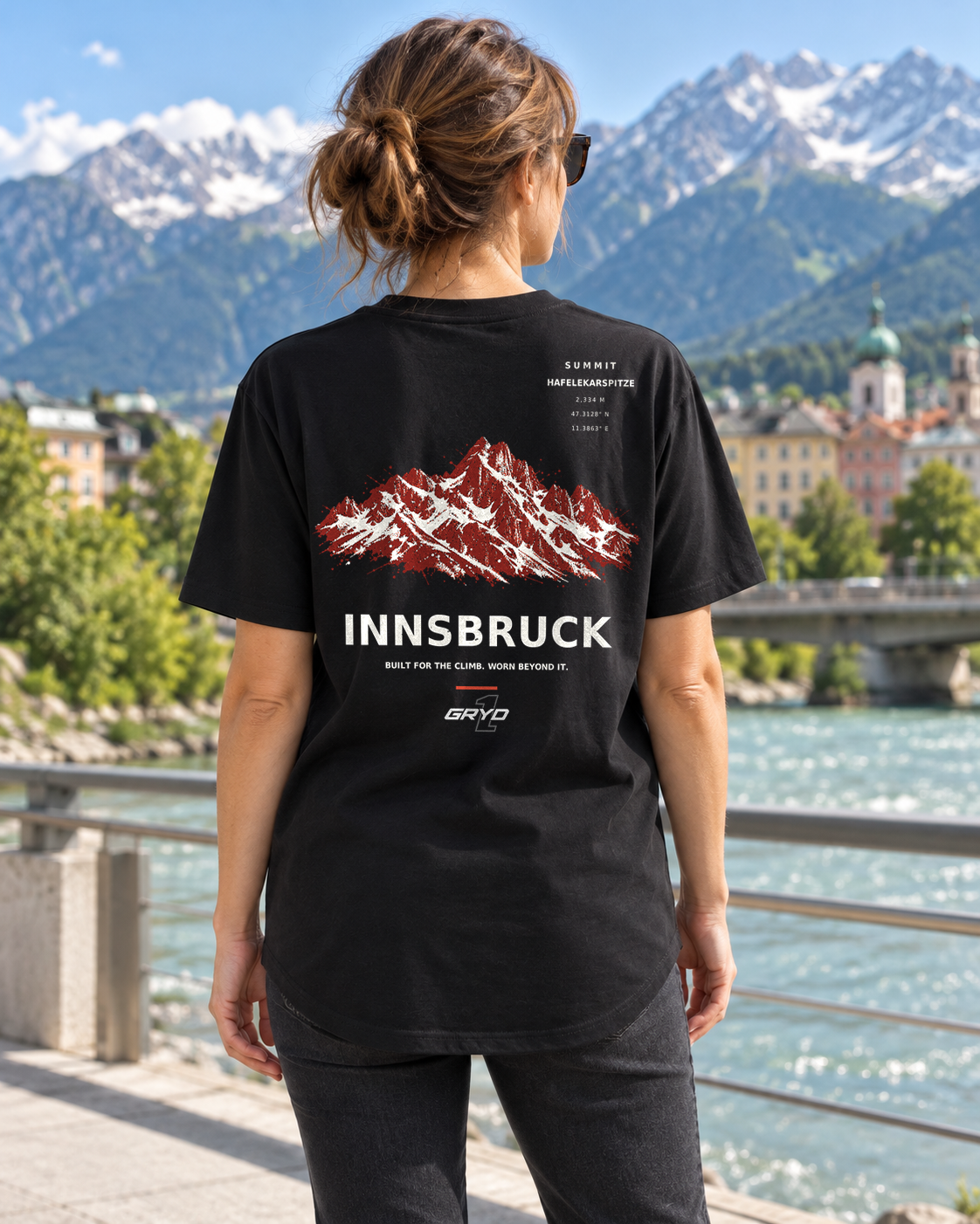 Person wearing a GRYD1 Summit Innsbruck T-shirt in an alpine setting | Shared