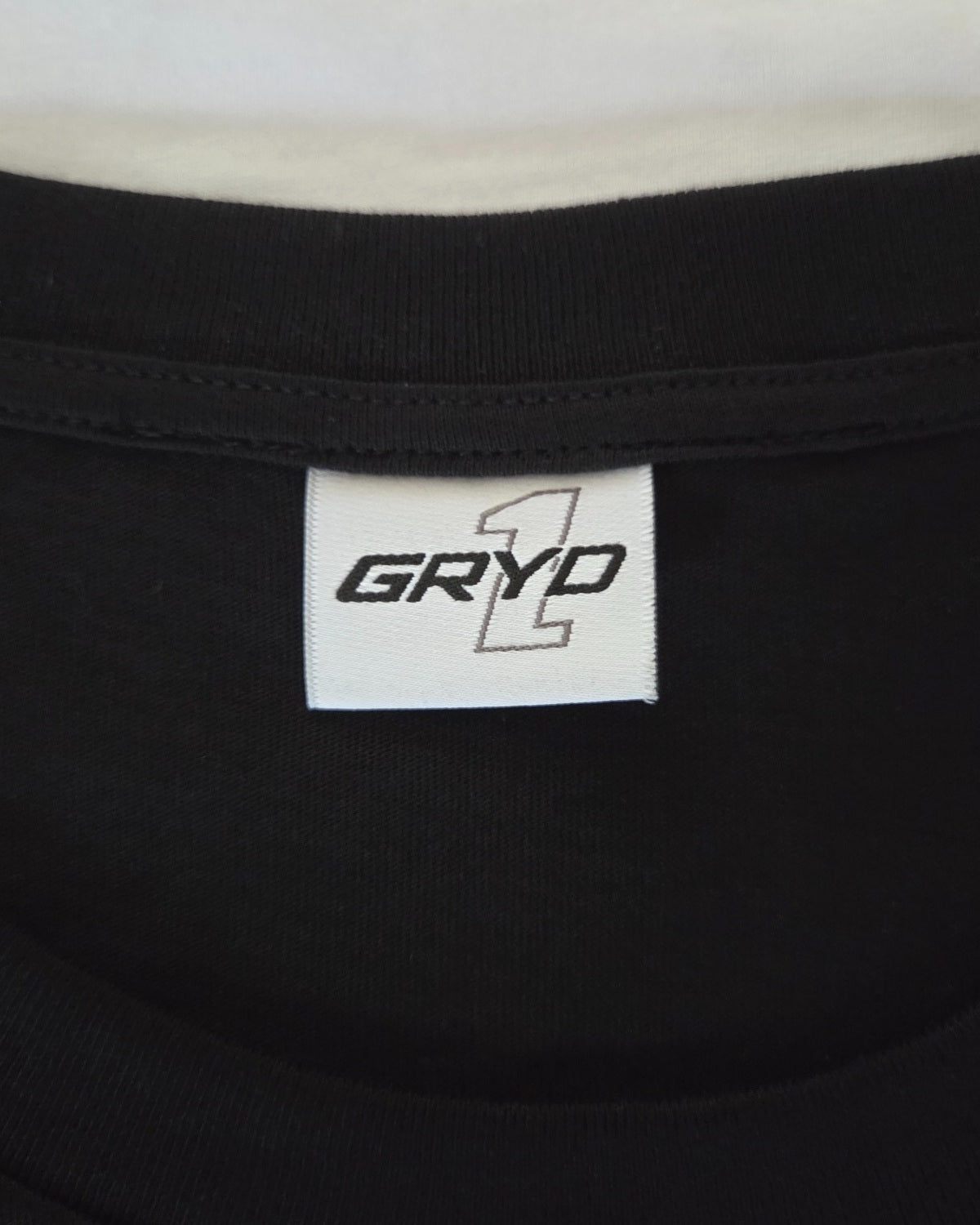 GRYD1 branded neck label detail | Shared